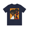 They Not Like Us Tee Shirt featuring two Black women in silhouette wearing high-fashion eyewear, holding a cell phone with the phrase "They Not Like Us" on an orange background – Afrocentric unisex apparel.