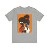 Two Black Women silhouette wearing fashionable eyewear on an orange background, featured on an Afrocentric unisex tee shirt