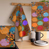 2026 Tea Towel Calendar featuring an abstract Tree of Life design with the names of the Top 10 HBCUs. Afrocentric kitchen decor and African American heritage gift.