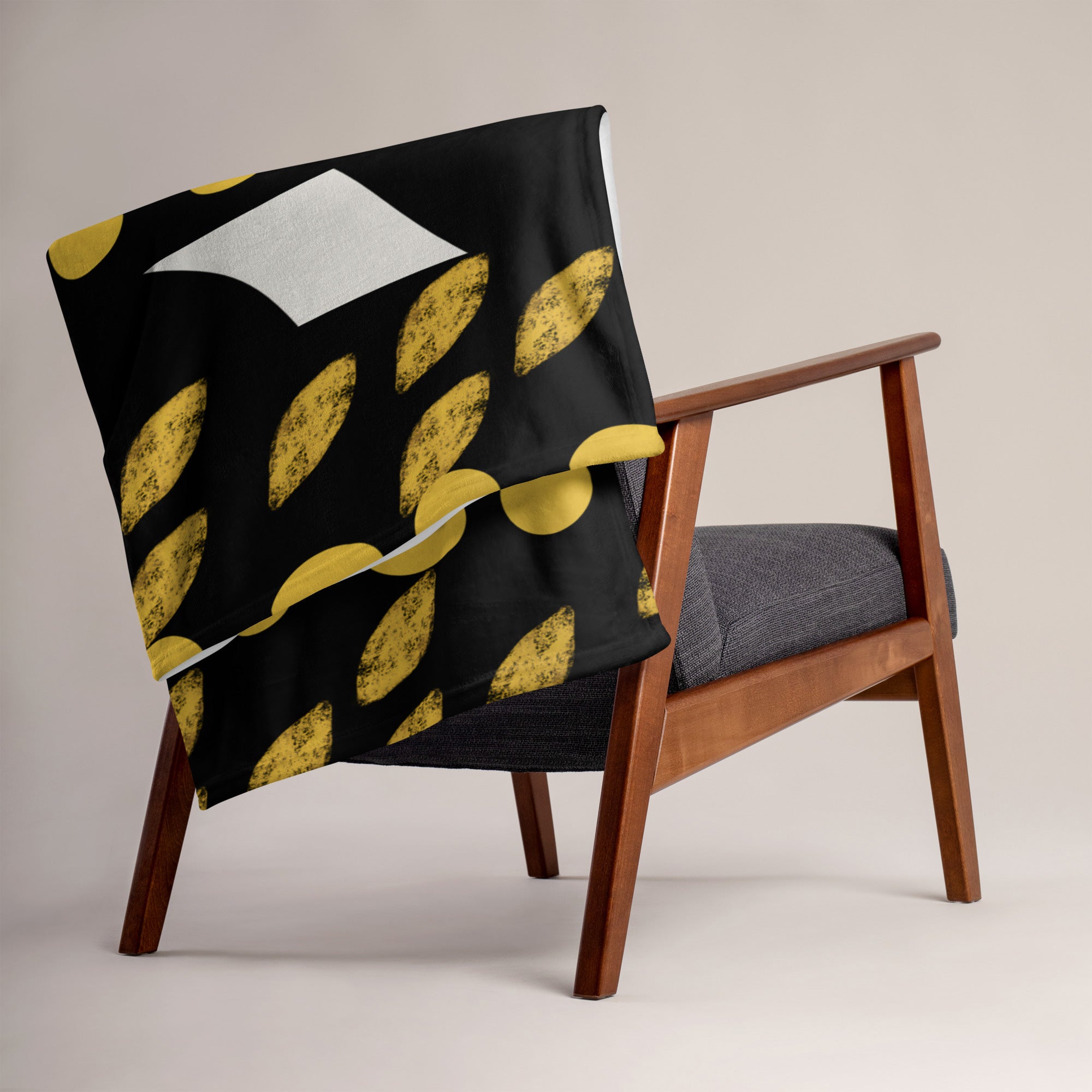 African Mud Cloth Print Velveteen Blanket accenting a chair.