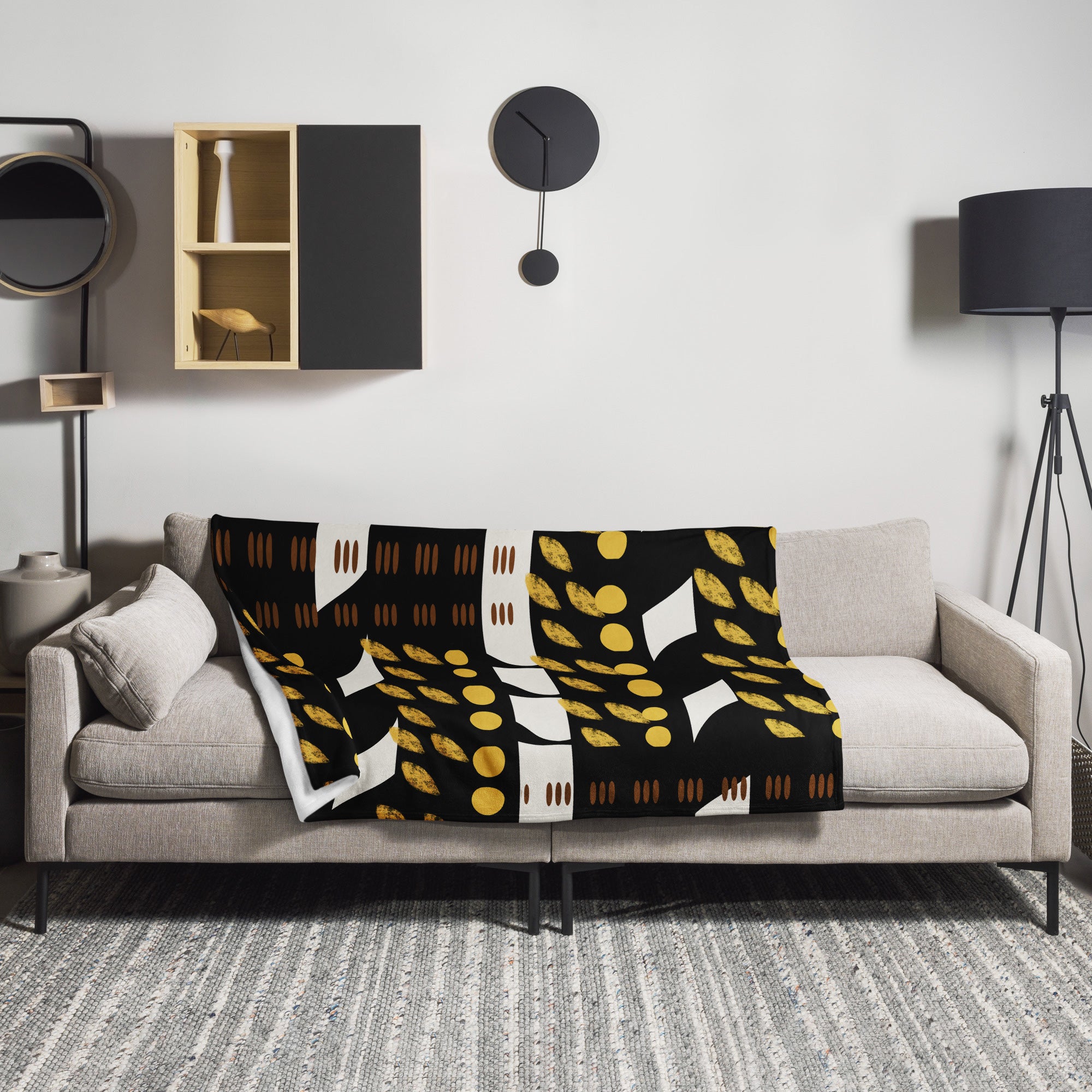 African Mud Cloth Print Velveteen Blanket accenting a sofa.