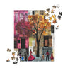 Afrocentric jigsaw puzzle featuring abstract African American art of Harlem street life. Silhouette figures walk through a patchwork-inspired cityscape with bold colors and geometric patterns, celebrating Black culture and community.
