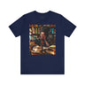 Black Girl Student Tee featuring a happy Black girl with dreadlocks studying in a library, surrounded by books. A stylish and empowering shirt celebrating Black college students and education.