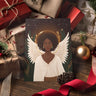 Black Woman Angel Holiday Greeting Card featuring an elegant African American angel illustration, available as a single card or multipack with envelopes.