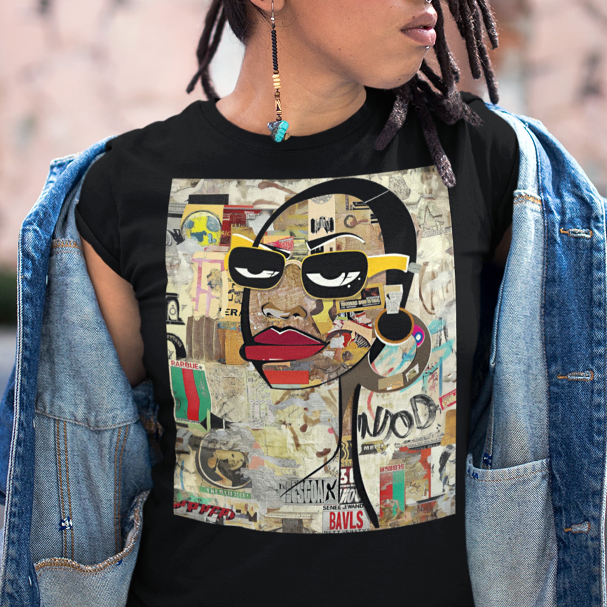 Boss Babe graphic tee featuring an abstract cartoon-style Black woman with bold yellow framed eyeglasses. The design has a vibrant, graffiti-inspired aesthetic that celebrates African American beauty, confidence, and urban art style.