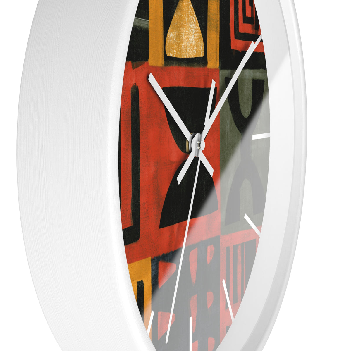 Side view of white Afrocentric abstract geometric round wall clock with white time markings and white clock hands, featuring African-inspired symbols, spirals, arches, stripes, and graphic patterns in red, black, mustard gold, charcoal, and earthy gray, displayed against a white background.
