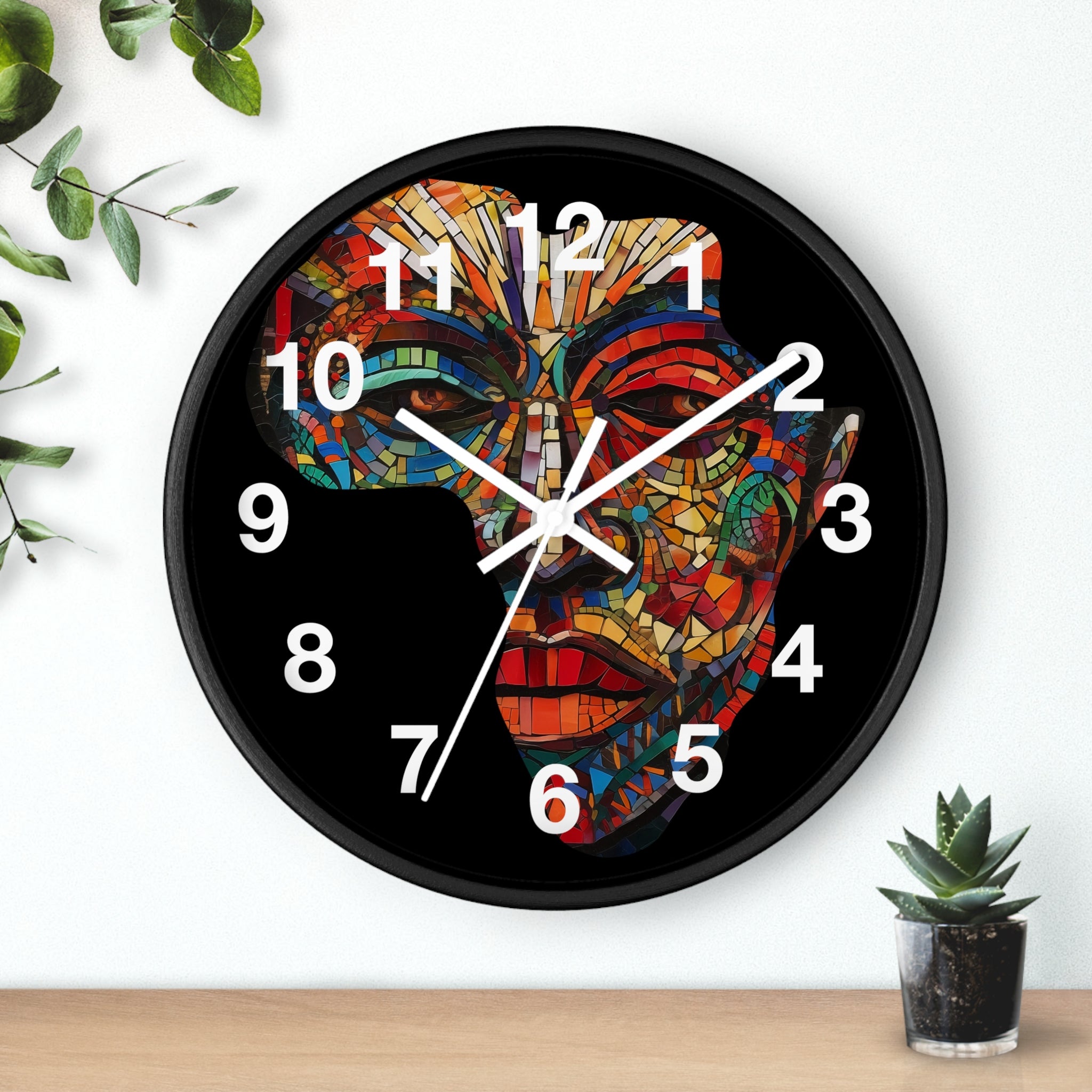 African Mosaic Mask Round Wall Clock featuring a mosaic-style African mask in the shape of the continent of Africa. Abstract Afrocentric wall decor with bold geometric patterns and vibrant colors.