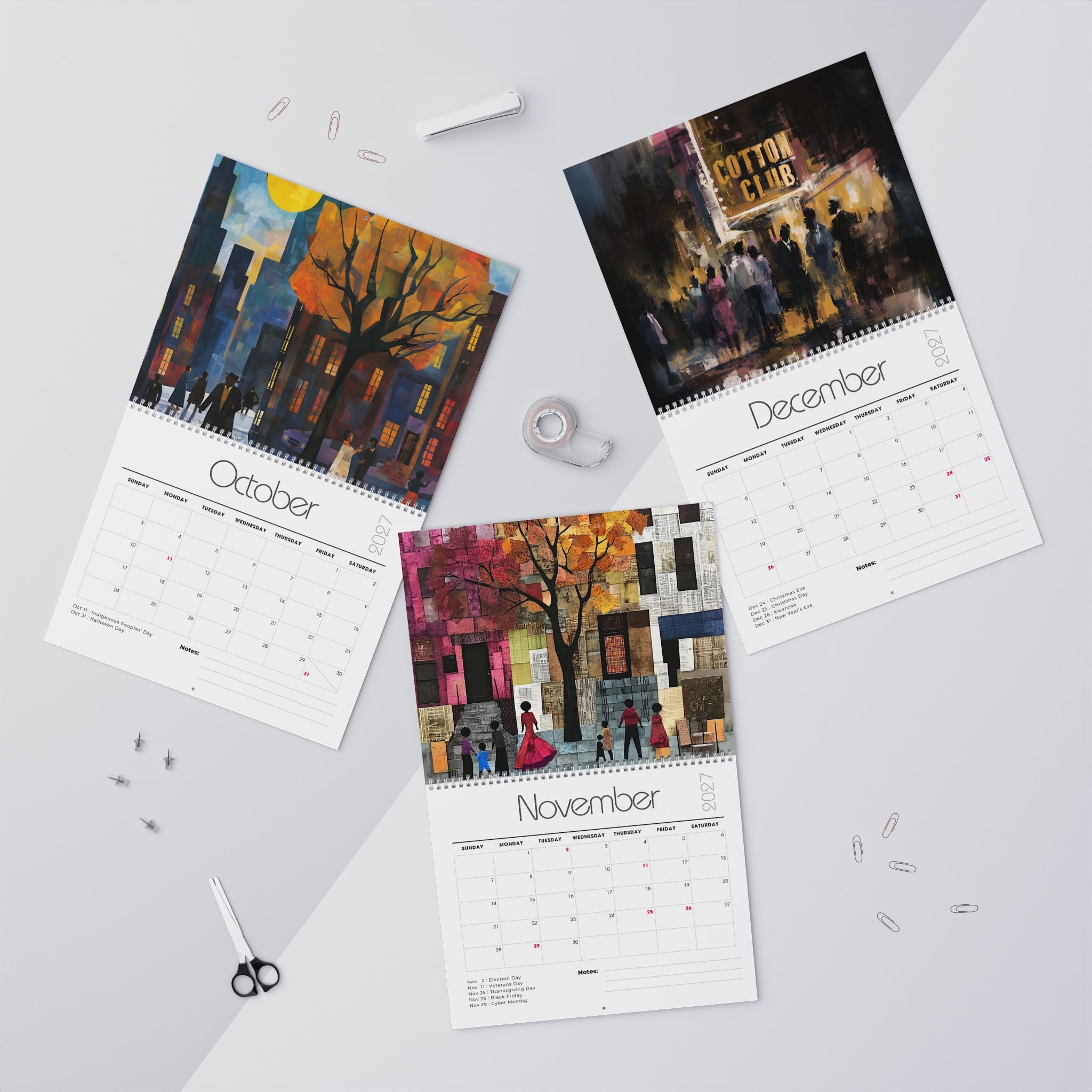 Three spiral-bound monthly calendars laid out on a light gray surface, each showing a colorful painted Harlem city street scene son the cover and a calendar grid page below. The visible months are October, November and December.