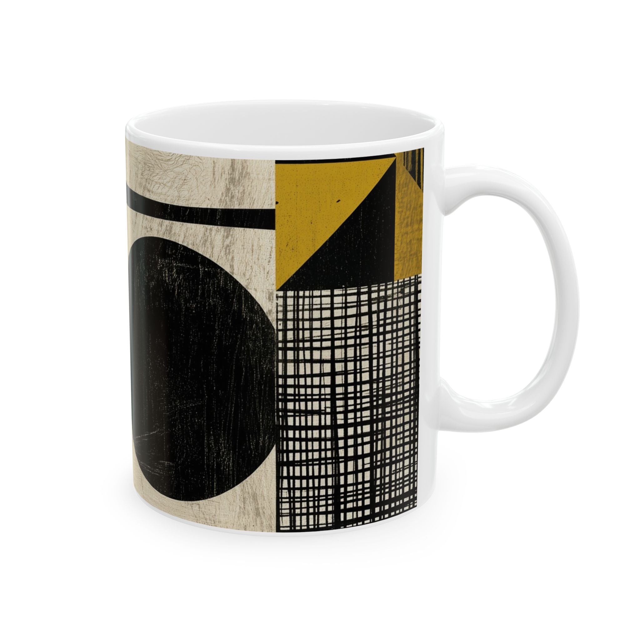 A white ceramic mug featuring a modern abstract geometric print with black, yellow, and beige textured blocks and lines, shown on a plain white background.