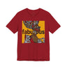 A red short-sleeve t-shirt featuring an Afrocentric Black woman with a large graphic print on the front with the word 'fabulous' in dark brown text over a collage of colorful objects.