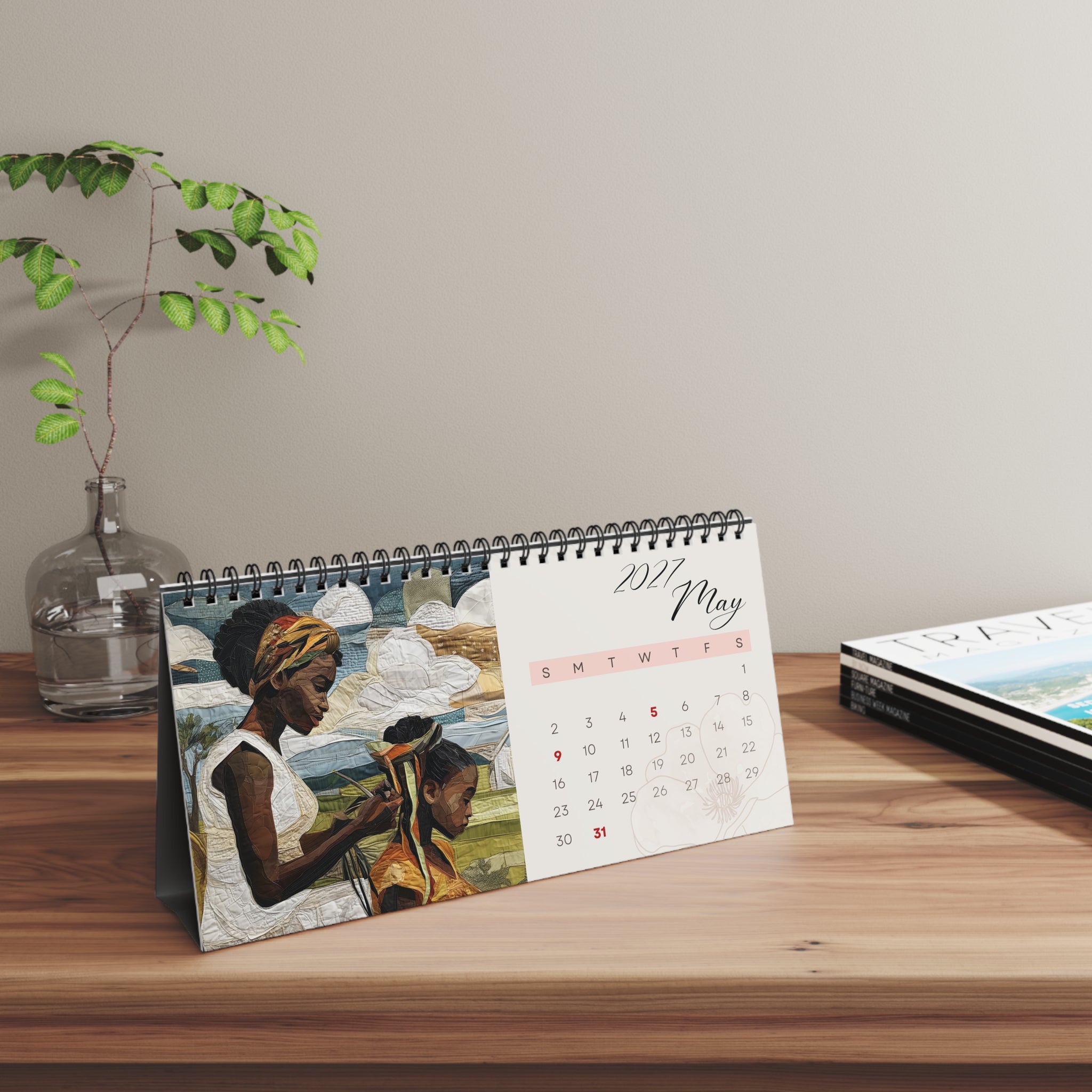 Horizontal spiral-bound 2027 desktop calendar featuring African American artwork of Black women gardening, hanging laundry on a clothesline, braiding a daughter's hair, and a young Black girl jumping rope.
