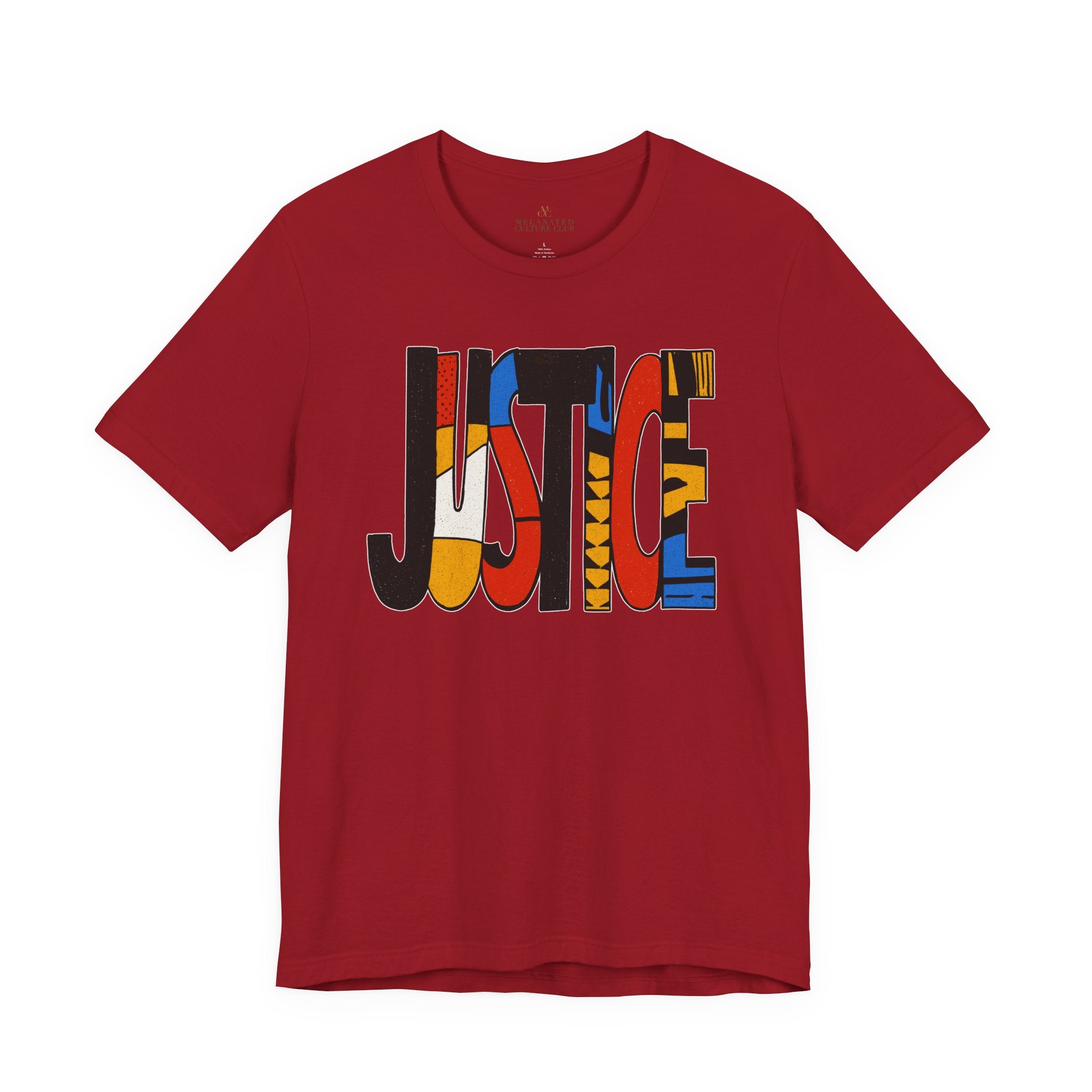 A red short-sleeve crewneck t-shirt featuring a large graphic on the chest spelling 'JUSTICE' in bold, multi-colored abstract shapes, shown against a plain white background.