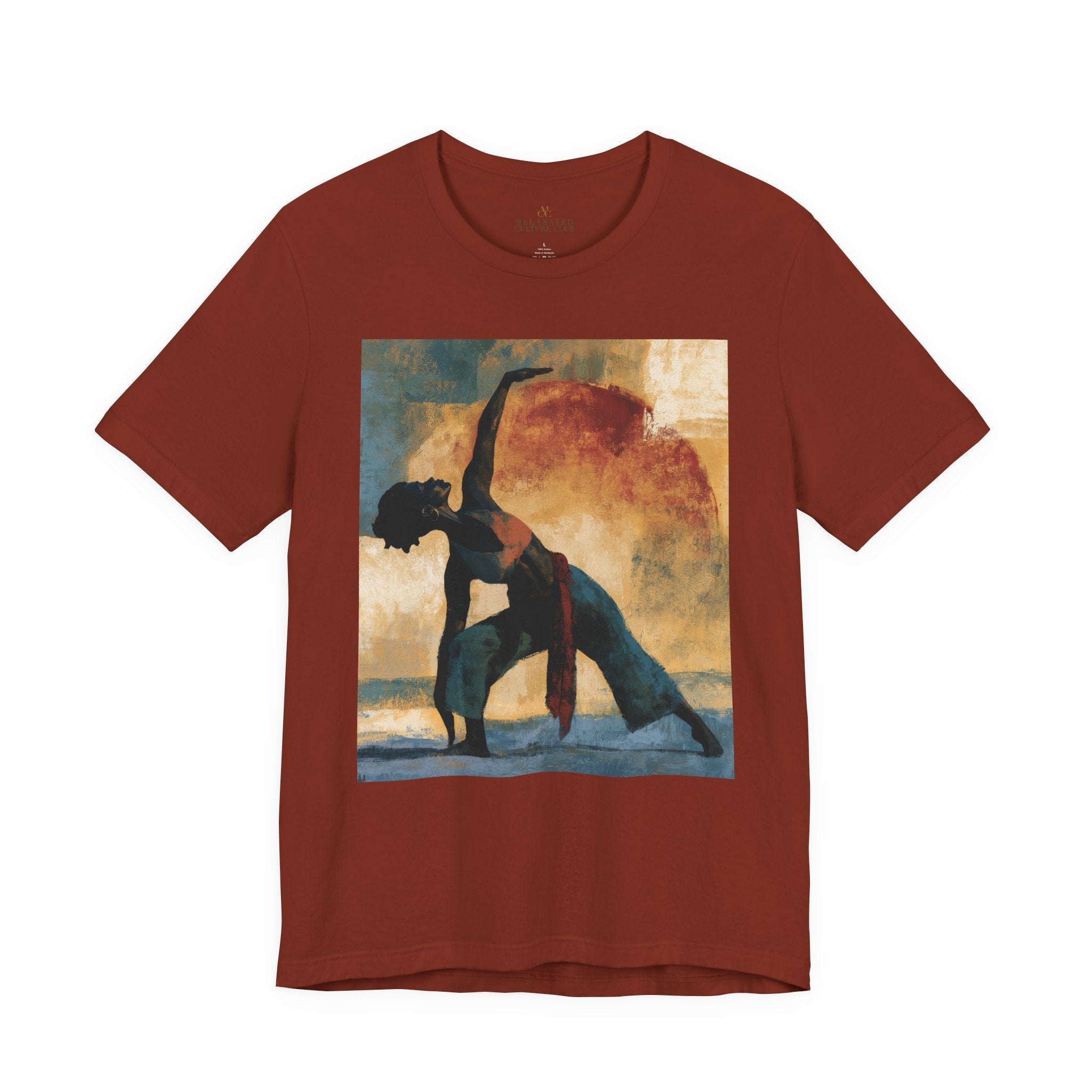 A rust colored short-sleeve crewneck t-shirt featuring a Black woman in a yoga pose against a warm, abstract sunset background.