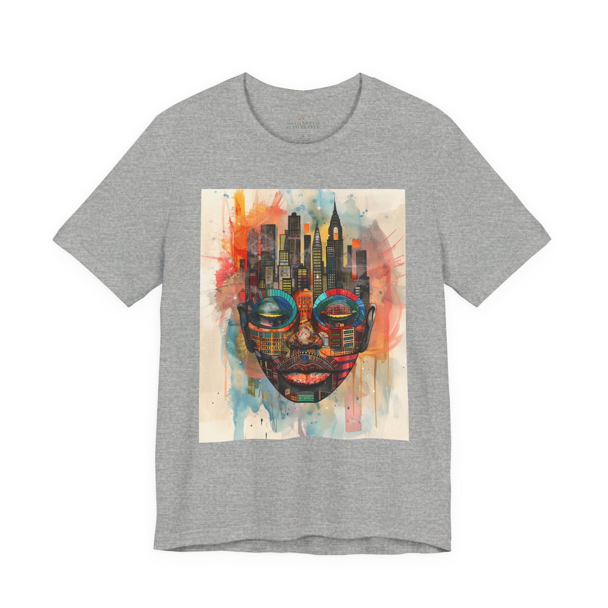 Afrocentric graphic t-shirt featuring an abstract African mask blended with the New York City skyline in a colorful watercolor style design celebrating Black culture and NYC pride.