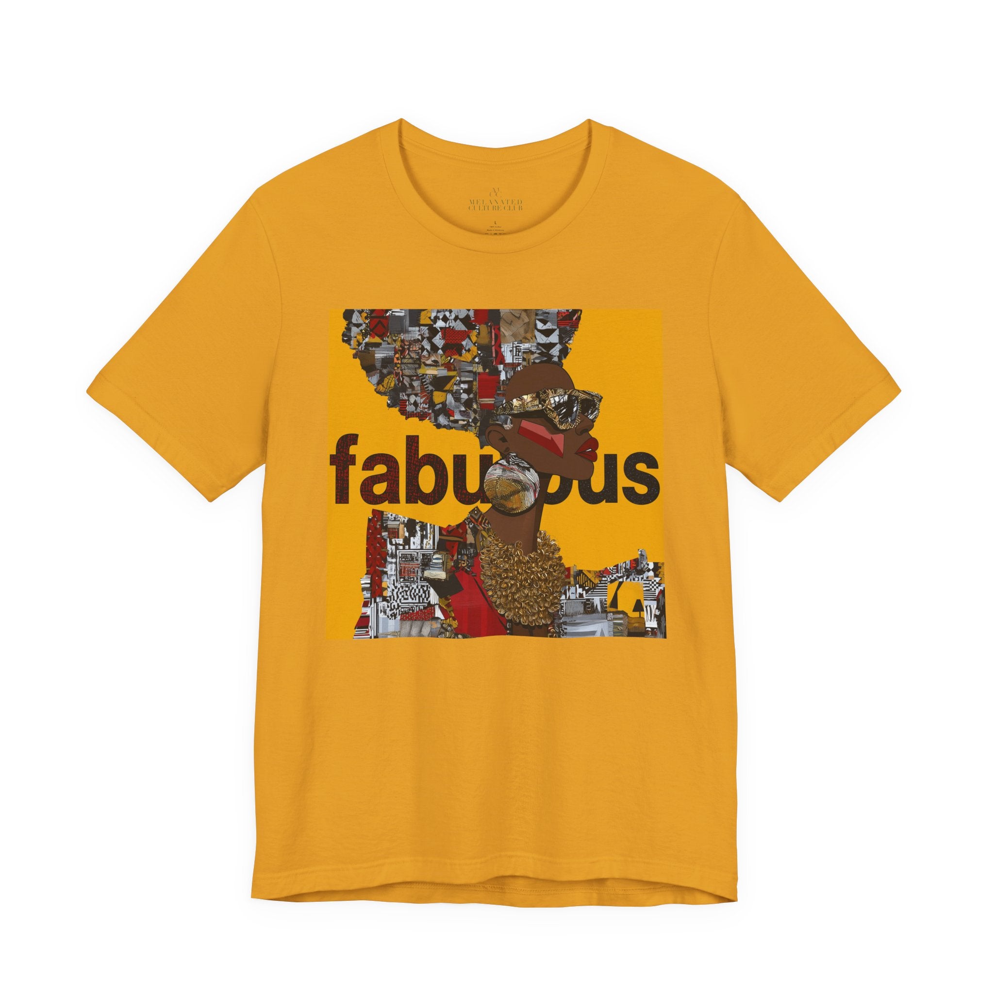 A mustard yellow short-sleeve t-shirt featuring an Afrocentric Black woman with a large graphic print on the front with the word 'fabulous' in dark brown text over a collage of colorful objects.