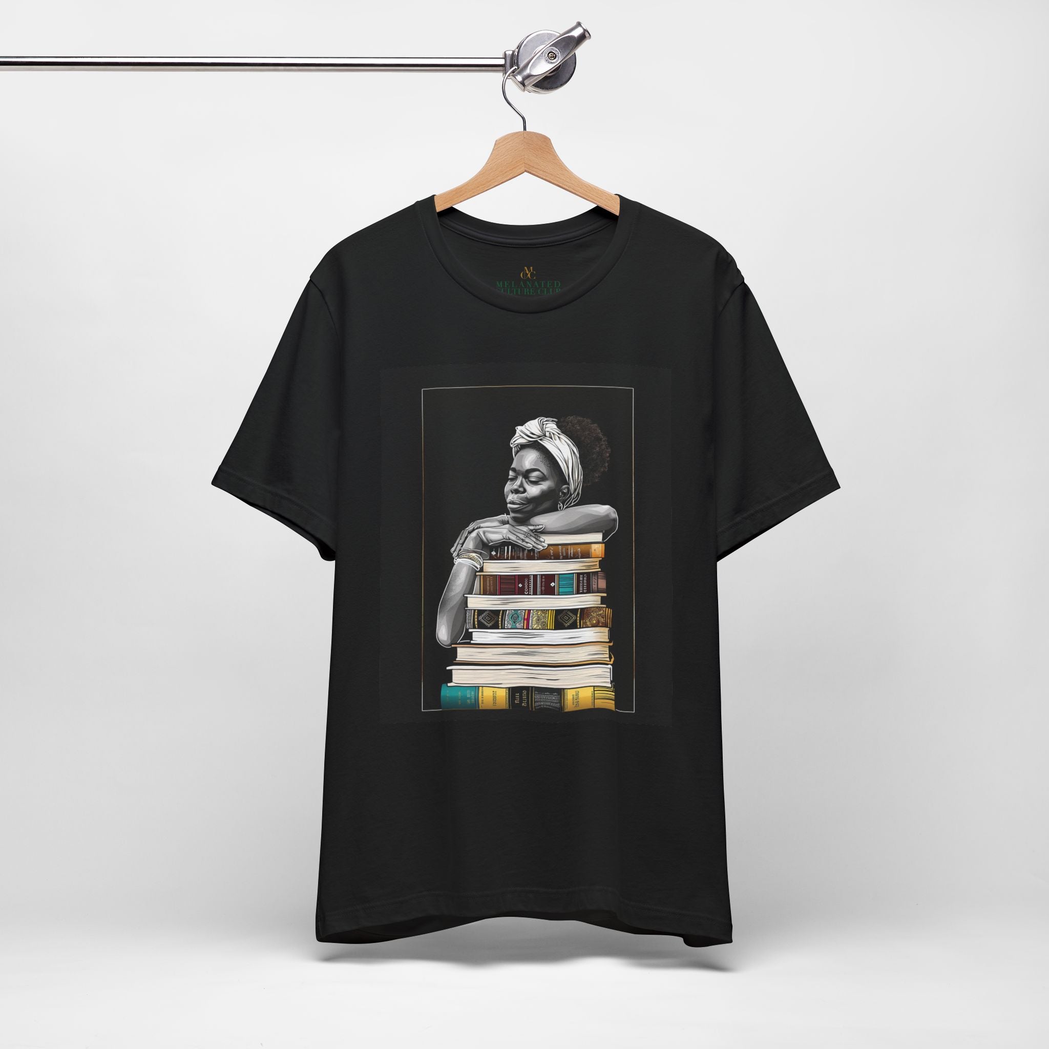 Afrocentric graphic tee shirt featuring a peaceful Black woman embracing a stack of books, symbolizing education, knowledge, freedom, and generational legacy.