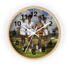 Round wall clock with a light wood frame and a printed dial showing four women walking on a golf course. The clock has black Arabic numerals and white hands, photographed against a plain white background.