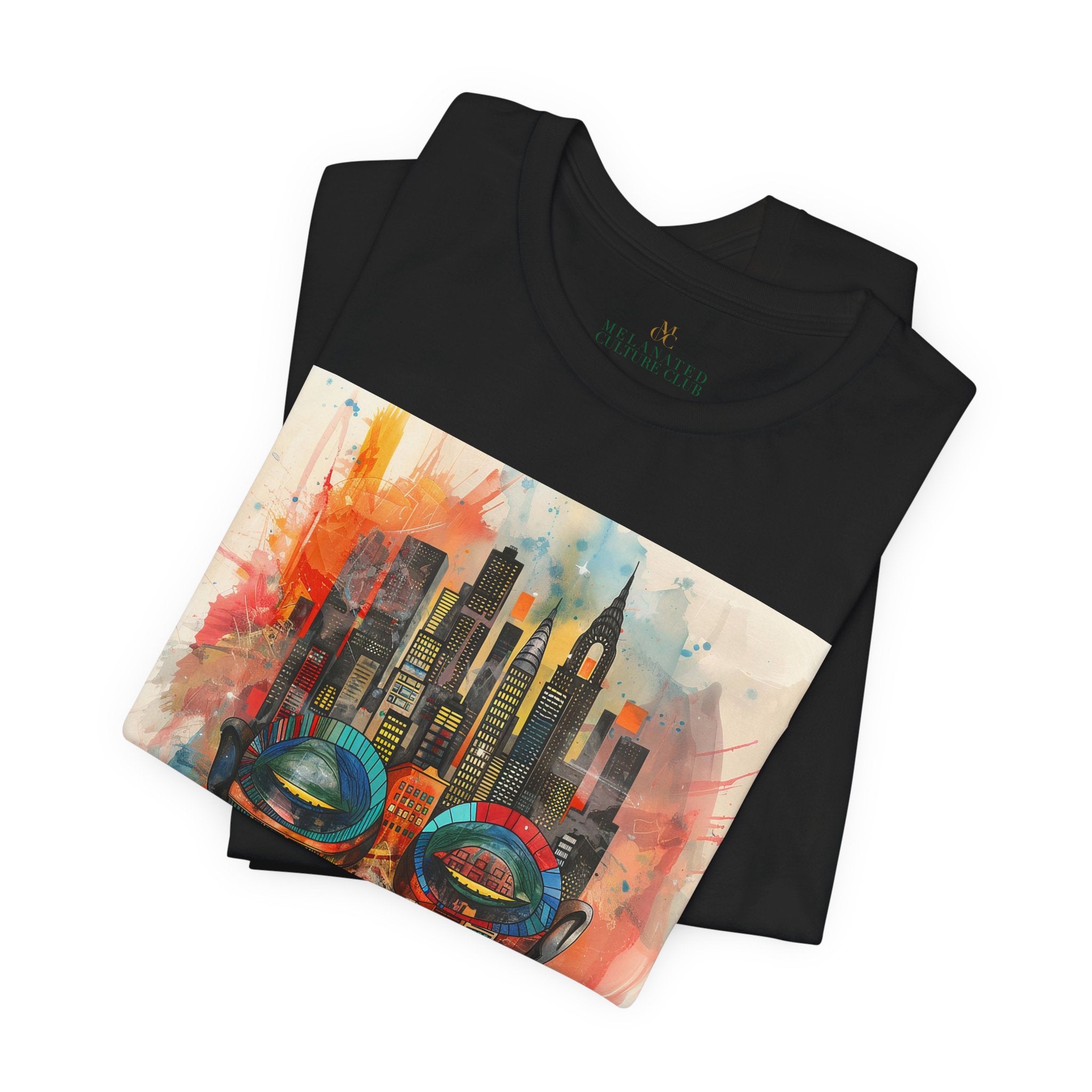 Afrocentric graphic t-shirt featuring an abstract African mask blended with the New York City skyline in a colorful watercolor style design celebrating Black culture and NYC pride.