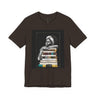 Afrocentric graphic tee shirt featuring a peaceful Black woman embracing a stack of books, symbolizing education, knowledge, freedom, and generational legacy.