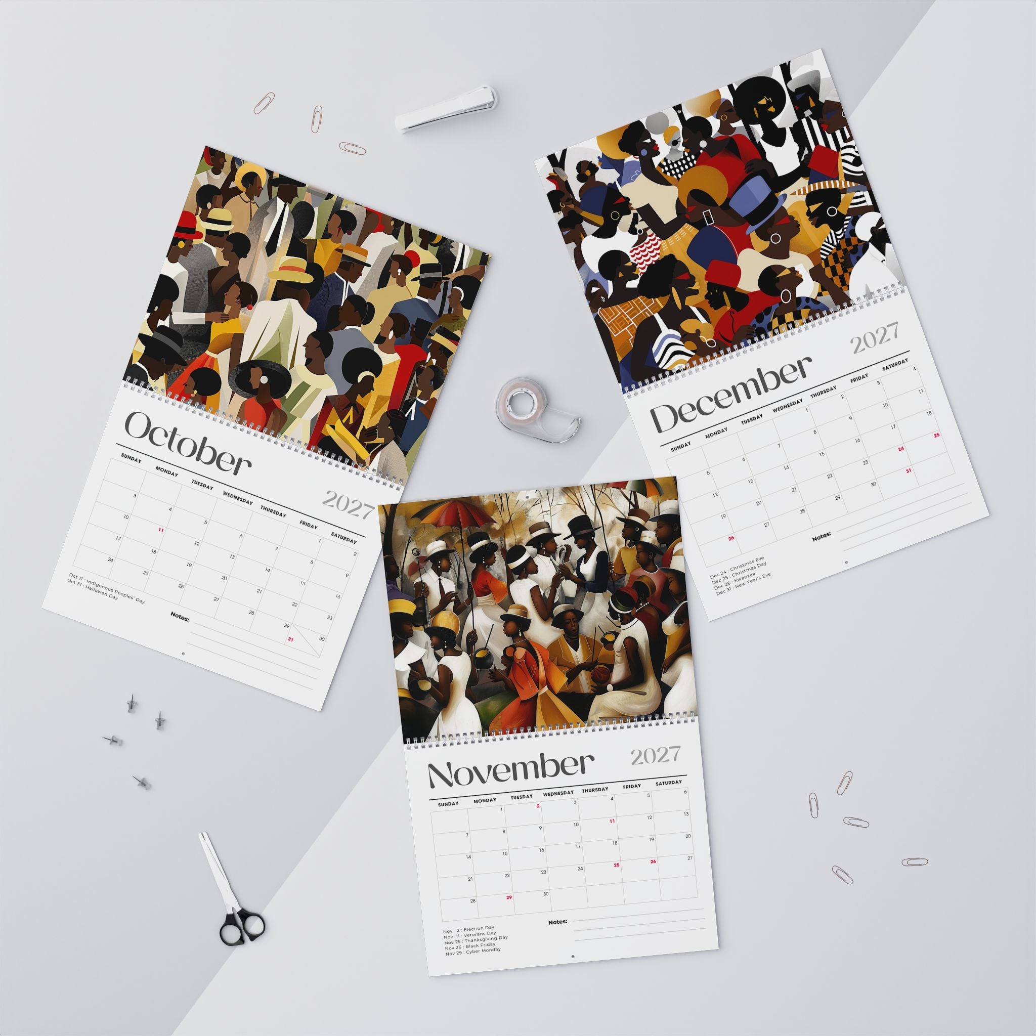 Picnic in the Park featuring the monthly calendar pages for October, November and December 2027 are arranged on a light gray surface with small stationery props around them.