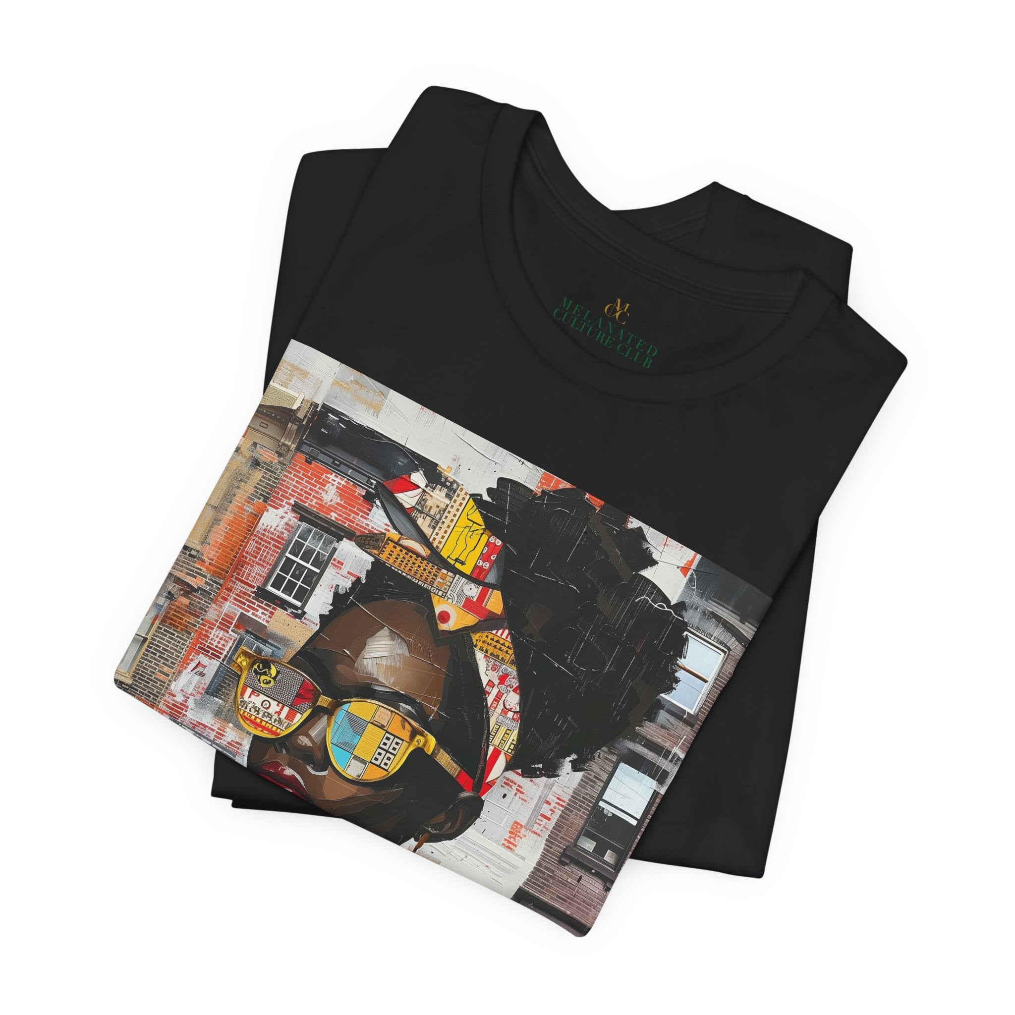 Folded view of Boss Babe Kendra abstract graffiti T-shirt in black against a white background.
