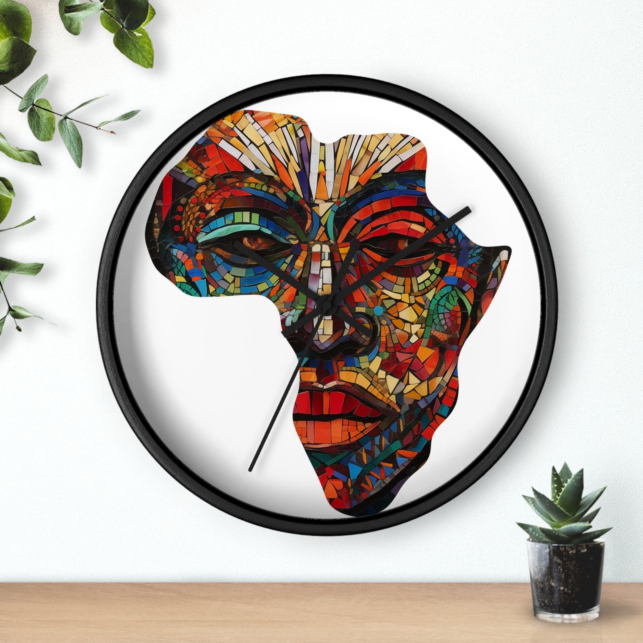 Black round wall clock featuring a digitally-generated African mask in the shape of the map of Africa.