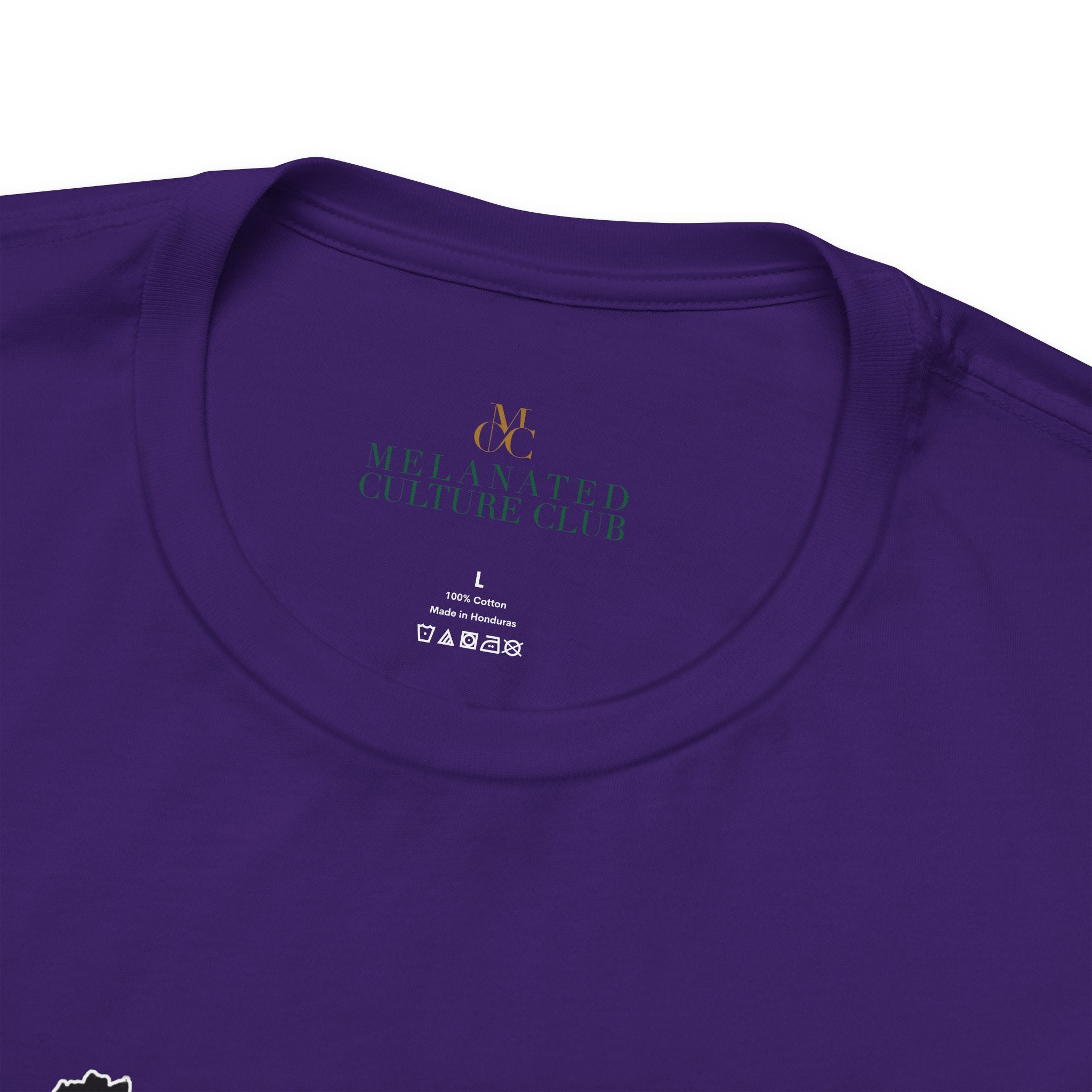 Close-up of a purple t-shirt with brand logo and size label.