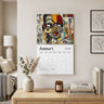A wall-mounted 2027 January calendar featuring a colorful collage portrait of a Black female with glasses, displayed in a styled living room above a wooden console table with books, a candle, and a vase. Size 14" x "11.5"