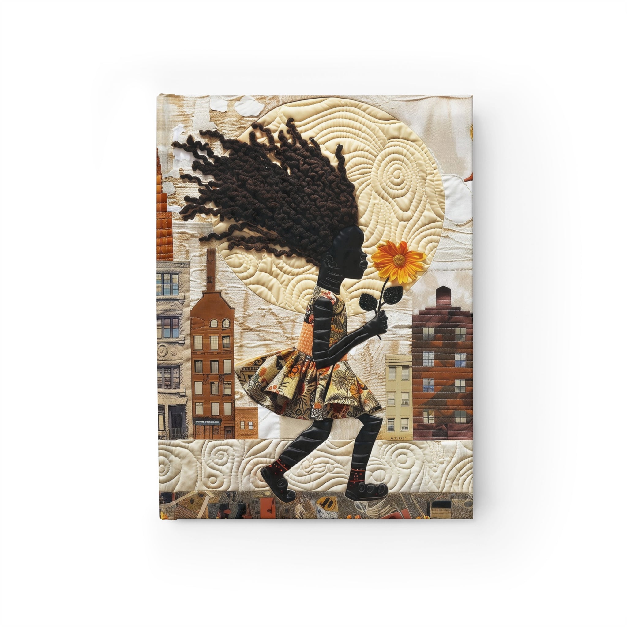 Front cover of a hardcover journal shown in a flat lay against a white background, featuring a young Black girl carrying a yellow sunflower as she walks through the historic streets of Harlem.