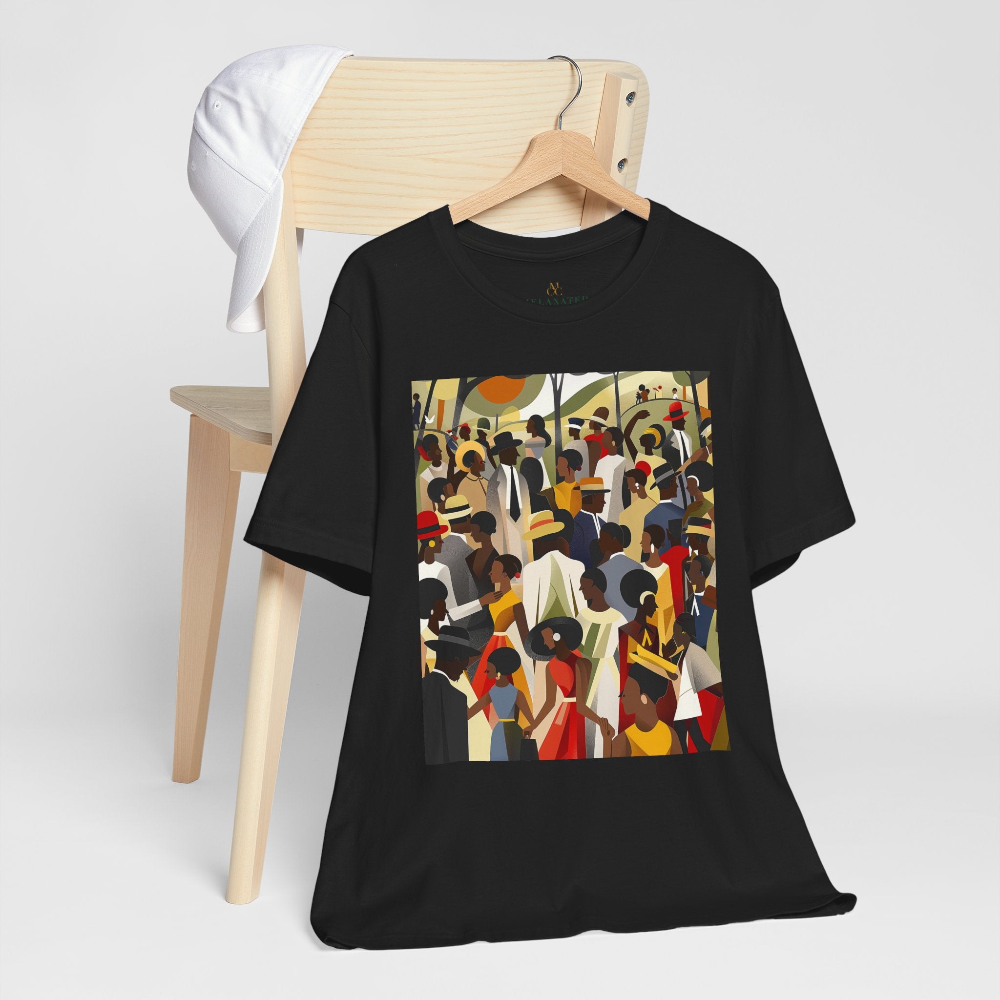 Juneteenth Celebration Tee Shirt featuring an Afrocentric design of Black people enjoying an outdoor picnic and family reunion. Adult unisex top honoring African American heritage, freedom, and cultural pride.