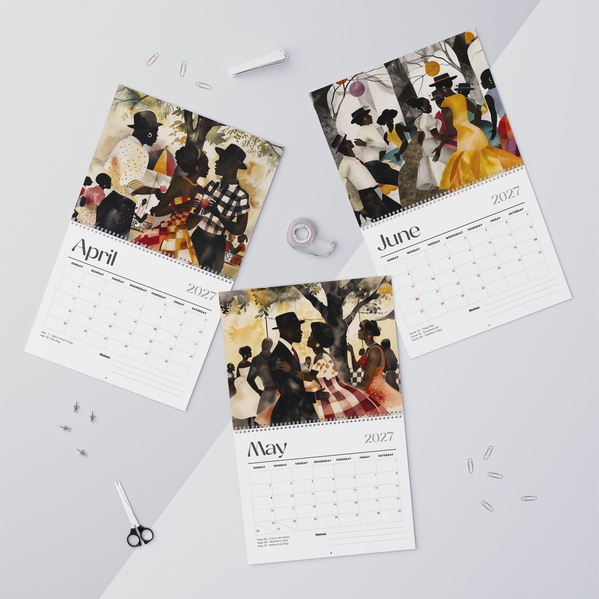 Picnic in the Park featuring the monthly calendar pages for April, May and June 2027 are arranged on a light gray surface with small stationery props around them.