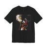 A black short-sleeve crewneck t-shirt featuring a square graphic print of an abstract portrait of a Black woman with dark hair, gold hoop earrings, and red lipstick on a black background.