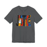 A dark gray crewneck t-shirt featuring a large graphic print on the front that spells 'JUSTICE' using various colorful patterns and textures.