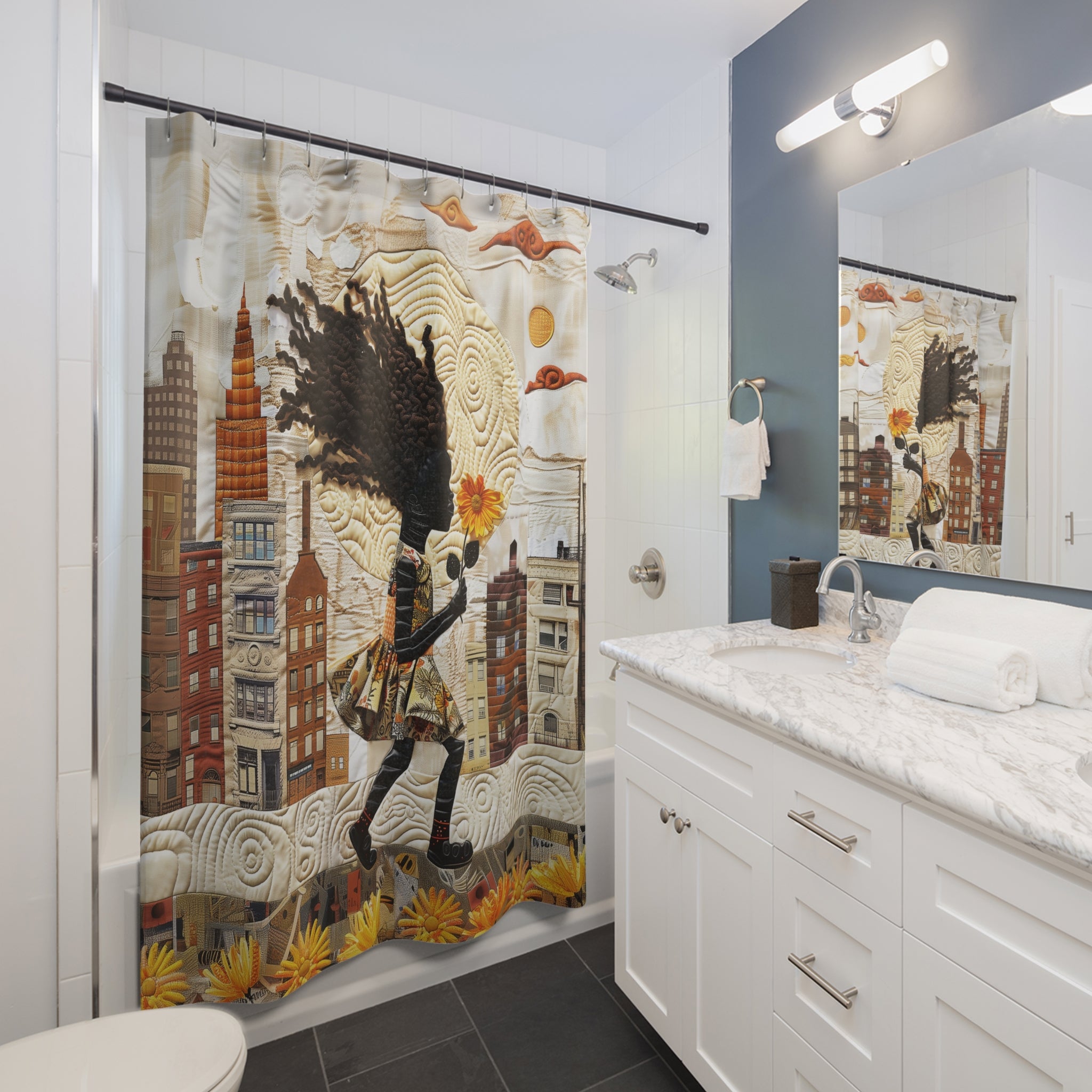 A bathroom scene showing a shower curtain with a whimsical Harlem cityscape illustration and a Black girl holding a sunflower The room includes a white vanity, marble countertop, mirror, and blue-gray accent wall.