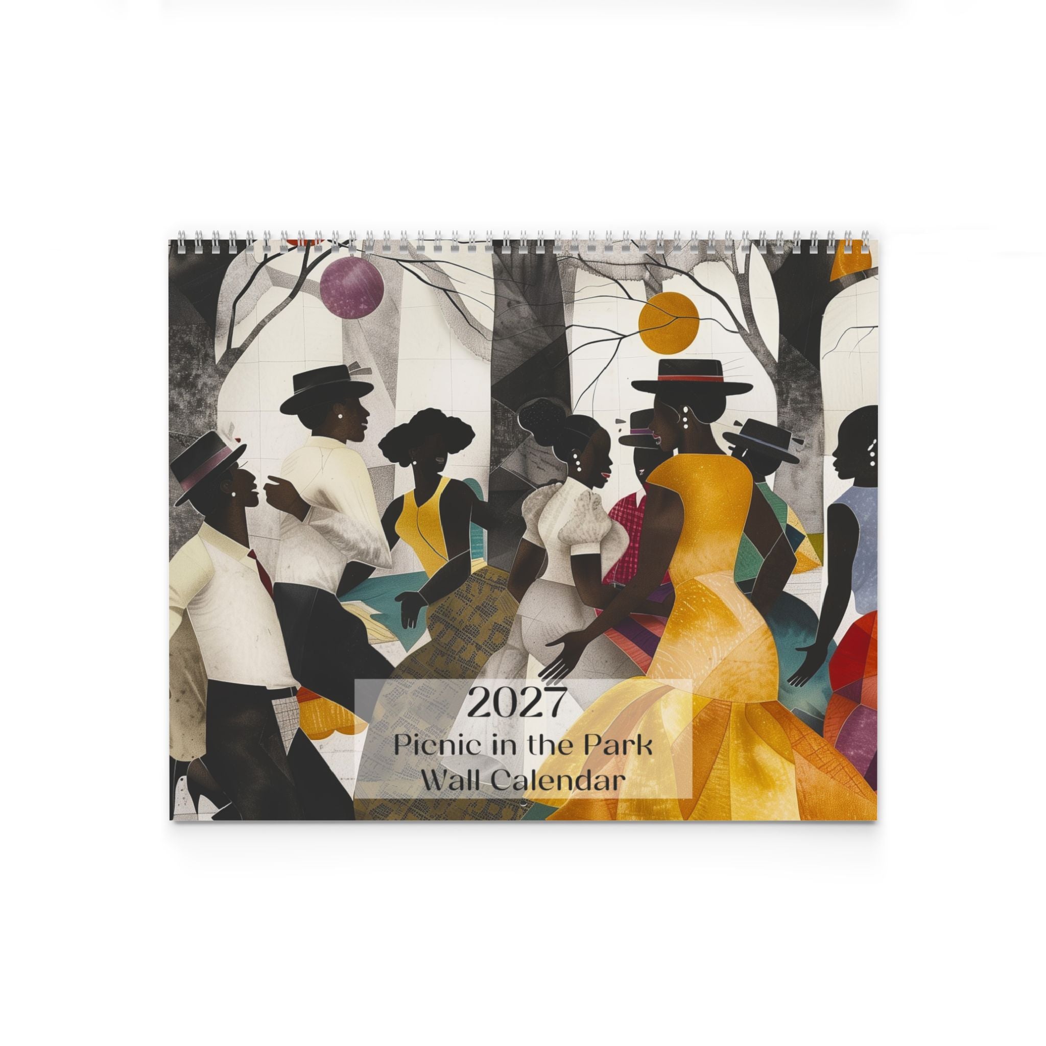 A spiral-bound 2027 wall calendar titled 'Picnic in the Park' featuring an artistic illustration of Black people having a picnic in a park with trees, balloons, and a yellow dress, shown against a plain white background.