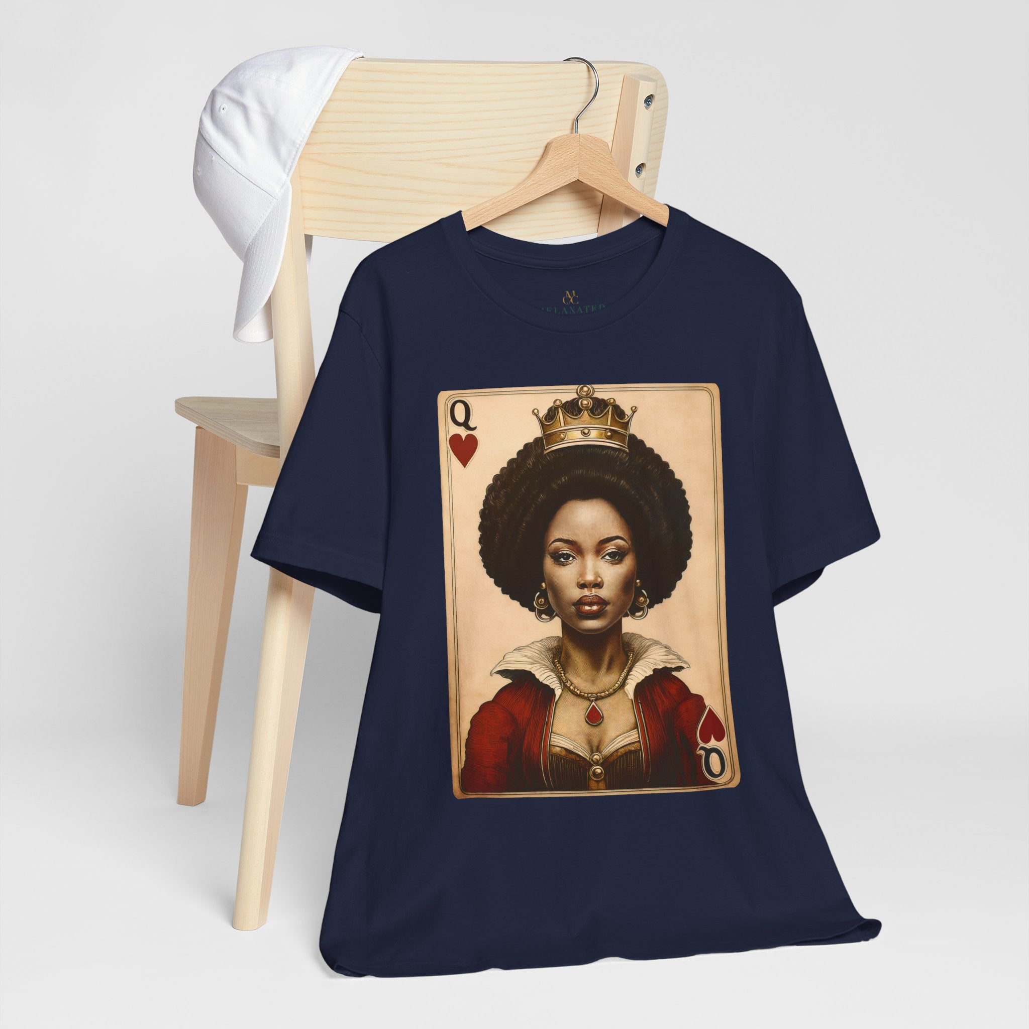 Black Queen of Hearts Tee Shirt featuring an illustrated African American woman with an afro and gold crown, styled as the Queen of Hearts playing card. Afrocentric vintage-inspired streetwear design in bold red, gold, and black colors.