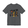 A dark grey short-sleeve crewneck t-shirt featuring a graphic print of the word 'JUSTICE' filled with stylized illustrations of African American faces in black, brown, and orange tones.