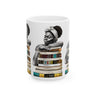 White coffee mug featuring an Afrocentric illustration of a peaceful Black woman embracing books, symbolizing education, knowledge, freedom, and generational legacy.