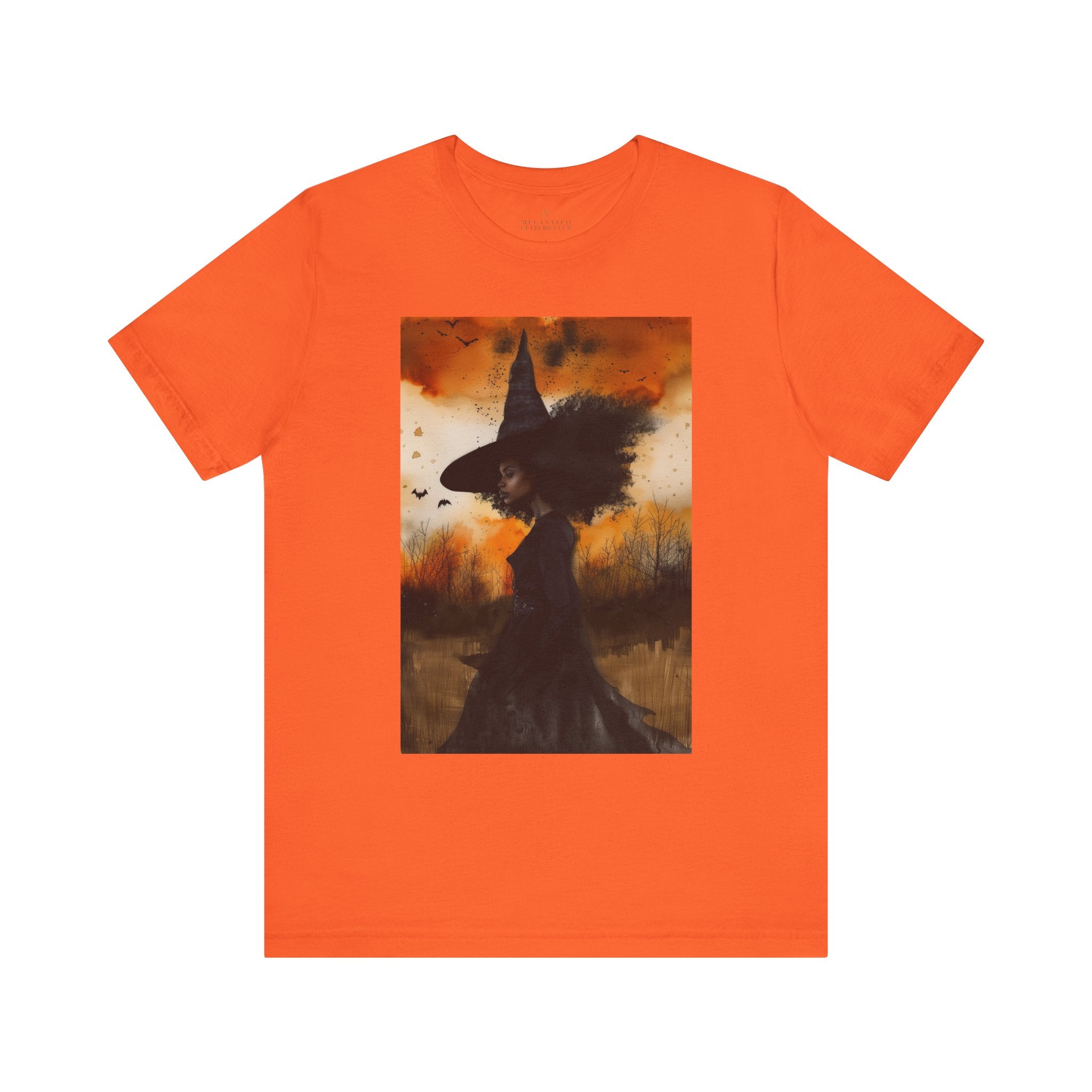 Afrocentric Black Witch T-Shirt featuring a watercolor illustration of an African American witch with black bats flying across a dark moody background. Unisex Halloween graphic tee with Afrocentric gothic design.