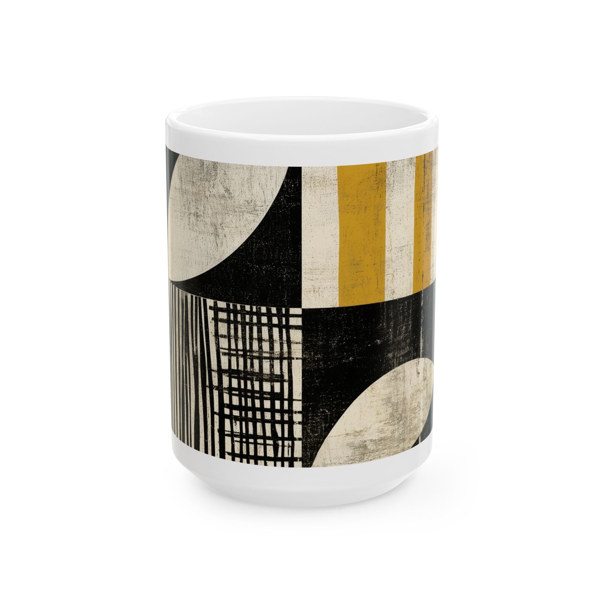 Front view of a 15 oz white ceramic mug with a modern abstract geometric pattern featuring black, cream, and mustard yellow blocks, lines, and curved shapes, shown on a plain white background.