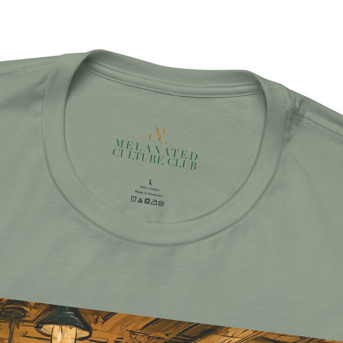 Detail of neck edge featuring brand logo, size and care instructions for a cartoon style Black Women Nail Salon T-Shirt in the color sage, displayed against a white background.