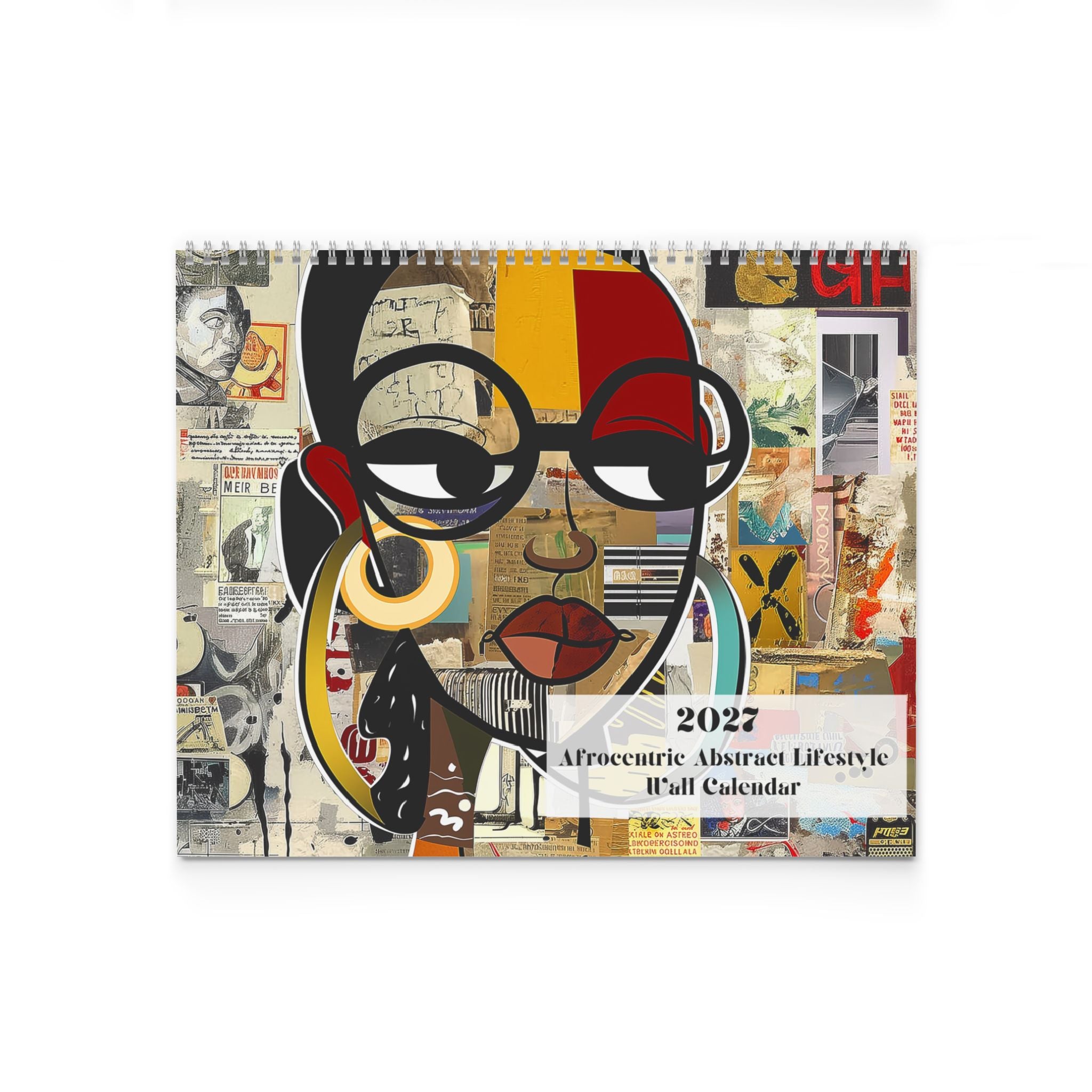 A spiral-bound 2027 wall calendar titled 'Afrocentric Abstract Lifestyle' featuring a bold collage-style portrait illustration of a Black female with glasses, lips, and abstract shapes in black, red, yellow, beige, and white.