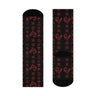 Crew socks featuring traditional Ghanaian Adinkra symbols in an Afrocentric pattern representing wisdom, strength, unity, perseverance, and African cultural heritage.