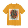 Afrocentric graphic t-shirt featuring an abstract African mask blended with the New York City skyline in a colorful watercolor style design celebrating Black culture and NYC pride.