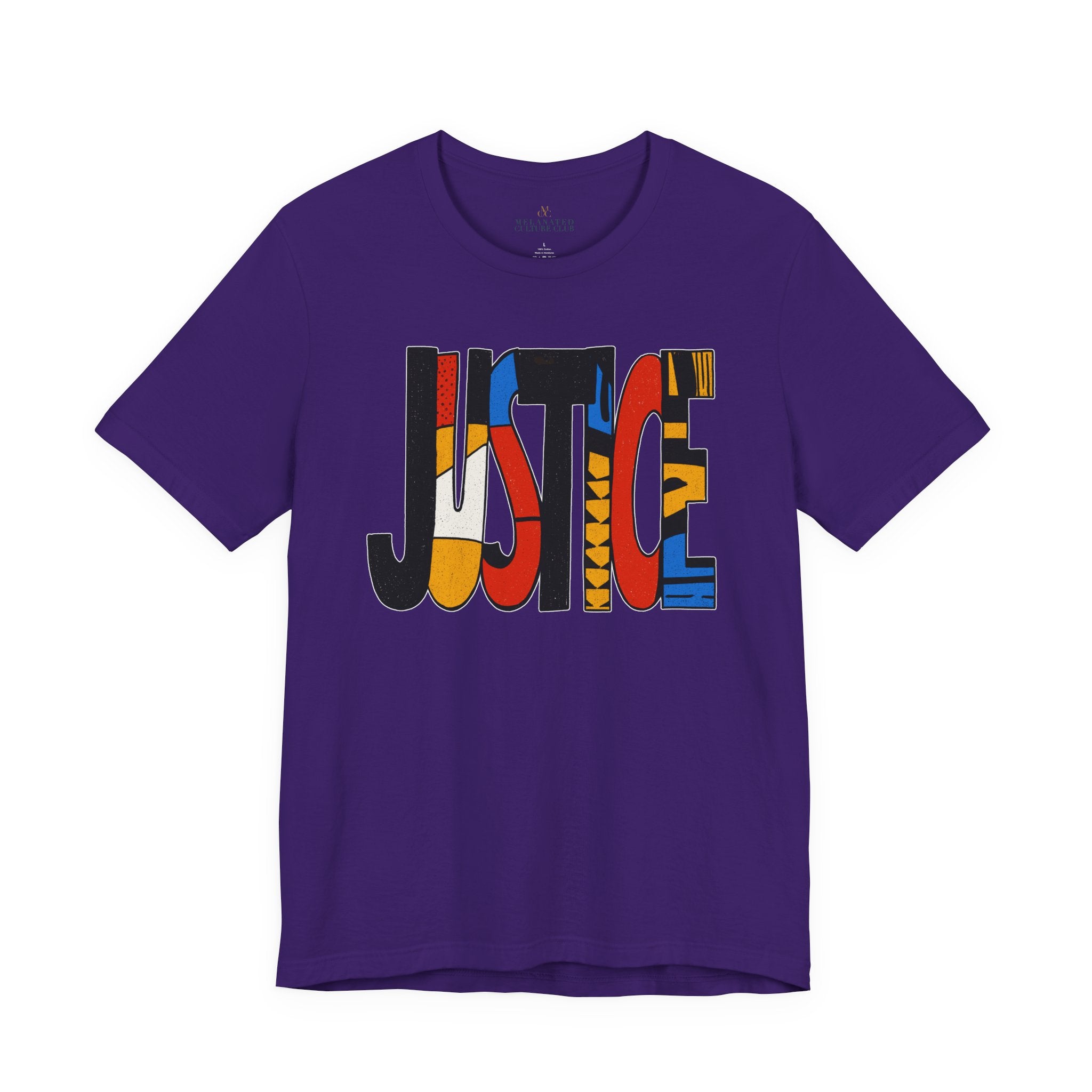 A purple short-sleeve crewneck t-shirt featuring a large graphic on the chest spelling 'JUSTICE' in bold, multi-colored block letters, shown against a plain white background.
