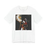 A white short-sleeve crewneck t-shirt featuring a square graphic print of an abstract portrait of a Black woman with dark hair, gold hoop earrings, and red lipstick on a black background.
