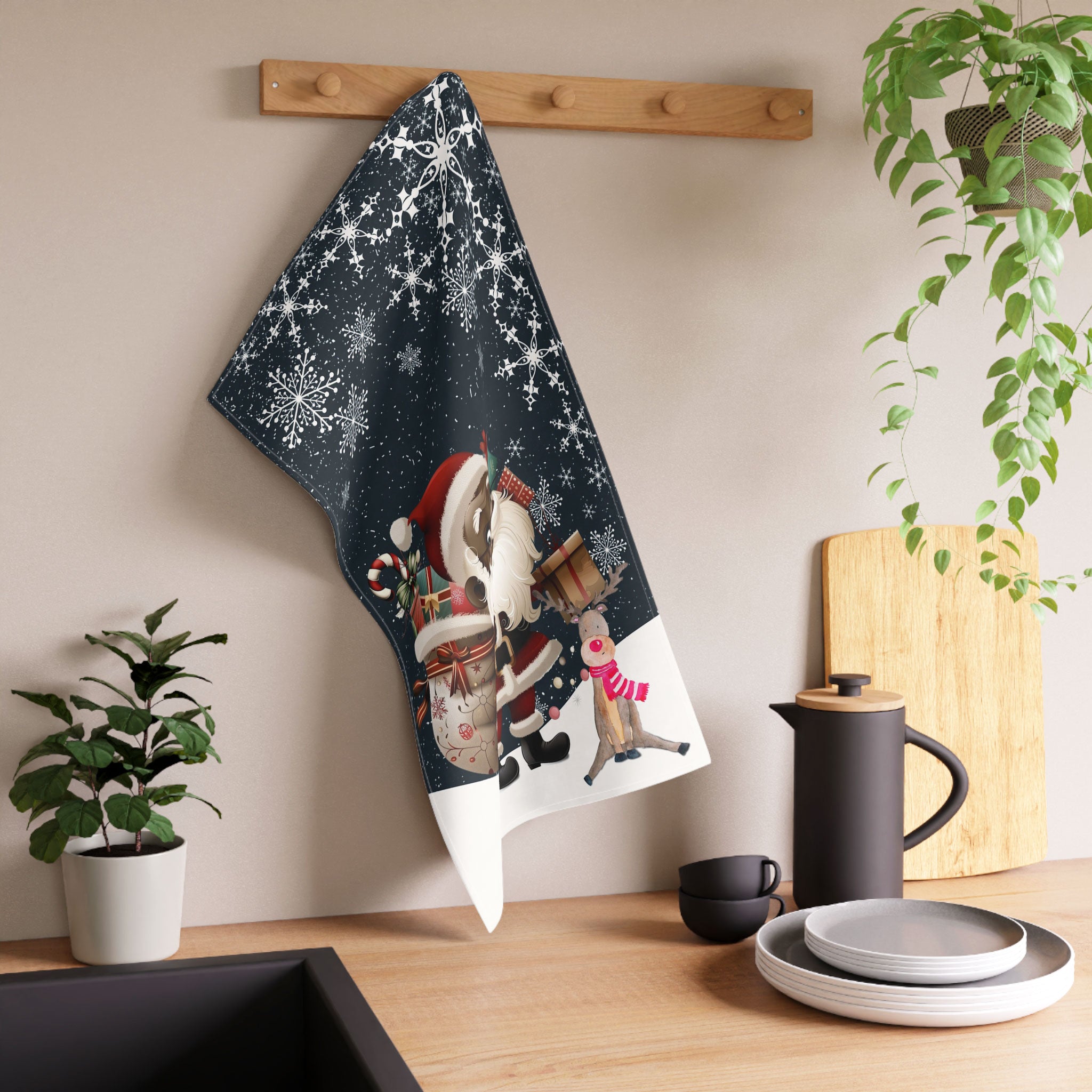 Black Santa and Reindeer Tea Towel with large snowflakes and falling snow – Afrocentric holiday kitchen decor.