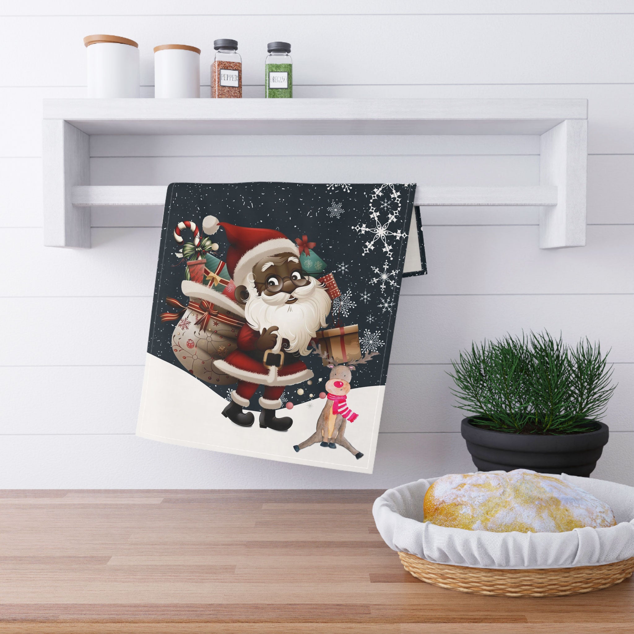 Black Santa and Reindeer Tea Towel with large snowflakes and falling snow – Afrocentric holiday kitchen decor.