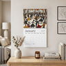 The Picnic in the Park 2027 wall calendar, featuring the month of January with abstract Black people dancing in celebration. Displayed on a beige wall above a wooden console table with a vase, candle, and books. Shown the 14" x 11" size calendar.