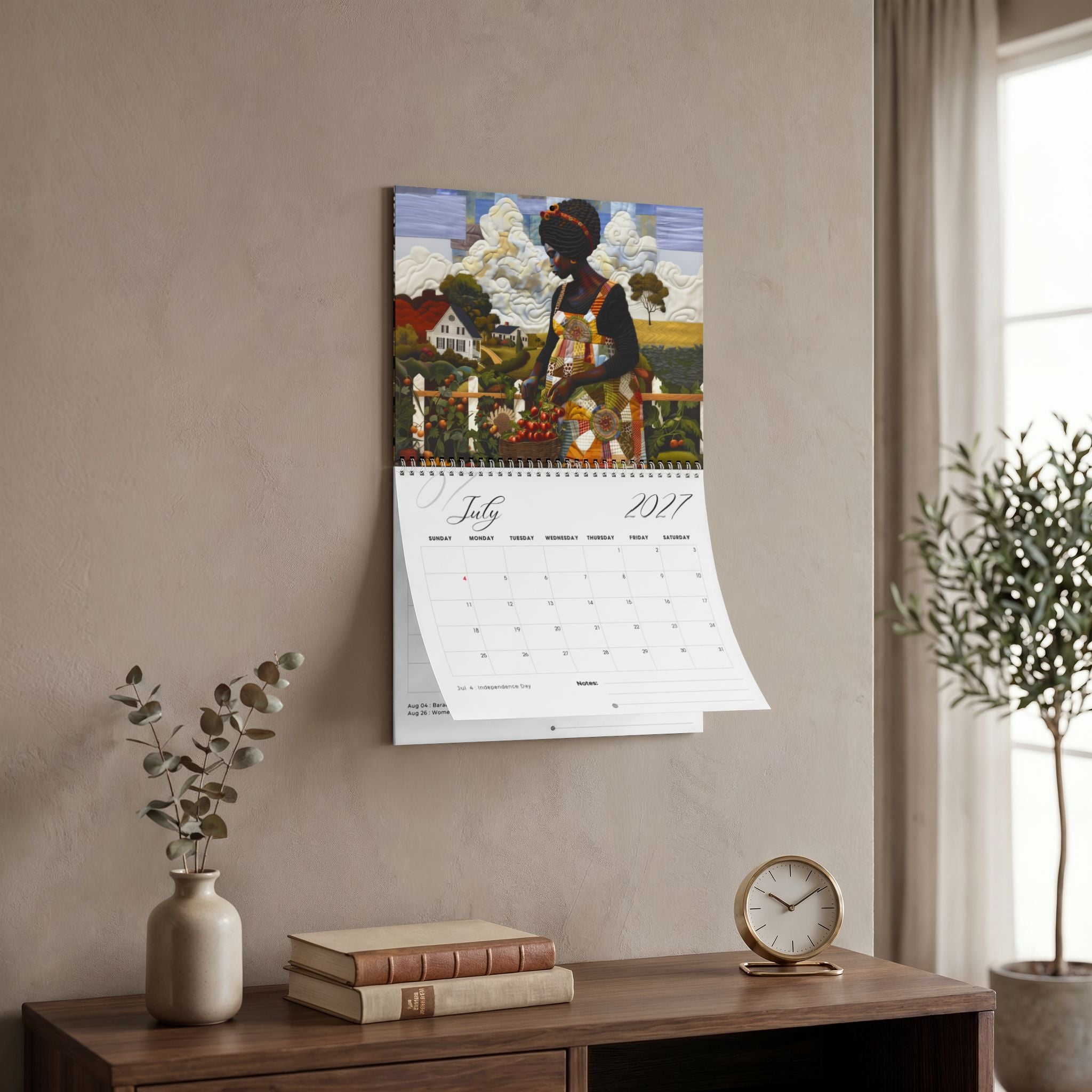 A side angle view of the Rooted in Home 2027 wall-mounted calendar hangs above a wooden console table in a styled living room. Size version 11" x 8.5".